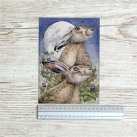 Hare art print beside ruler to show size