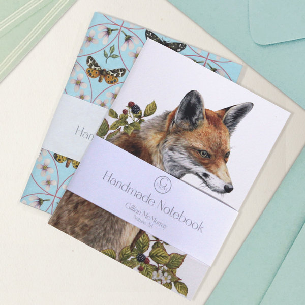 Red fox and moth pattern notebook on cream background with envelopes