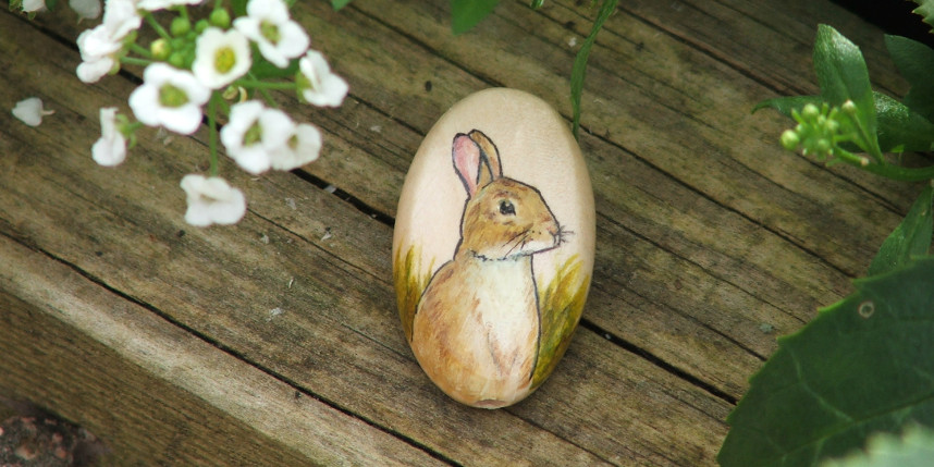 Rabbit hand painted on an oval wooden bead